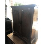 An oak two door cupboard