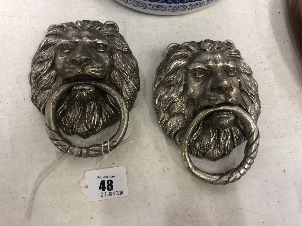 Two lion door knockers