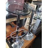 A pair of contemporary hydraulic bar stools