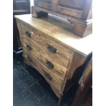 A small oak chest of three drawers