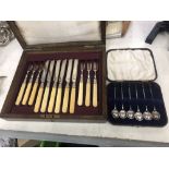 A cased set of fruit cutlery and cased coffee spoons