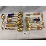 A set of eight hallmarked silver seasonal/year spoons and forks,