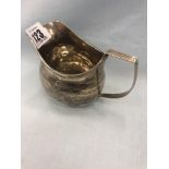 A hallmarked silver milk jug,