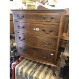 A small walnut chest of four drawers