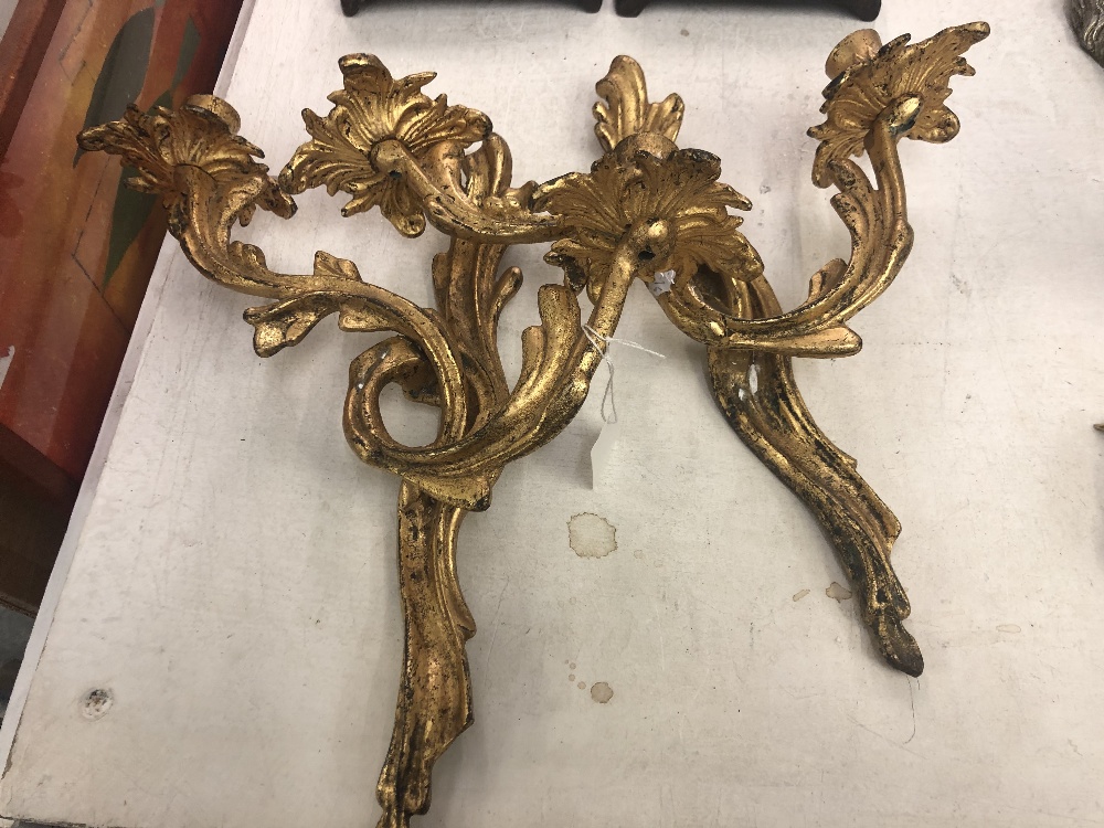 A pair of gilt wall sconces