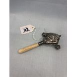 A HM silver and bone rattle (one bell missing)