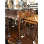 A mahogany serpentine sideboard