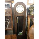 An oak long case clock