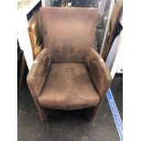 A small brown suede fireside chair