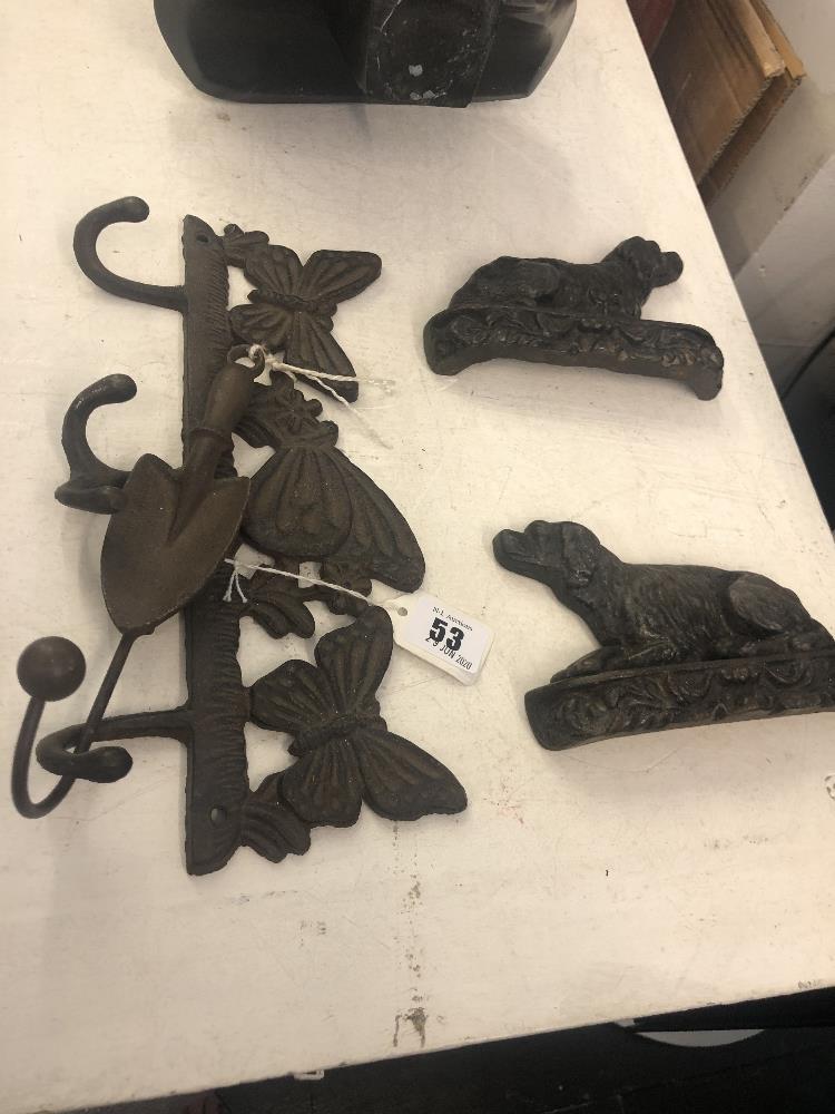 A pair of Victorian cast iron dog book ends and an early cast coat hanger - Image 2 of 2