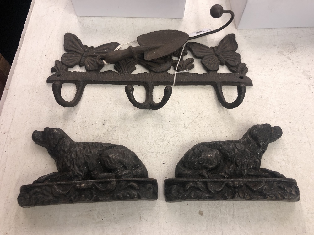 A pair of Victorian cast iron dog book ends and an early cast coat hanger