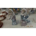 A pair of Lladro figures of children