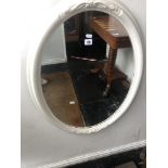 An oval painted mirror