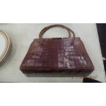 A Vintage crocodile handbag,