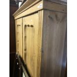 A 19th century pine double wardrobe.