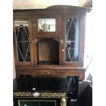 An oak leaded light cabinet