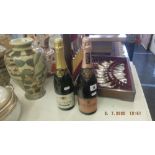 A bottle of Piper-Heidsieck pink champagne and a bottle of Charle D' Harleville champagne