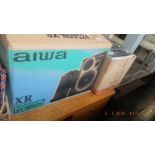 An Aiwa hifi with boxed speakers