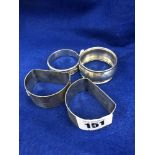 Four hallmarked silver napkin rings (pair plus two others)
