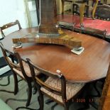 A mahogany Regency style table and six chairs with one leaf