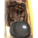 A fur stole and a Bowler hat by Dunn and Co