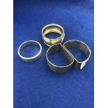 Four hallmarked silver napkin rings (pair plus two others)