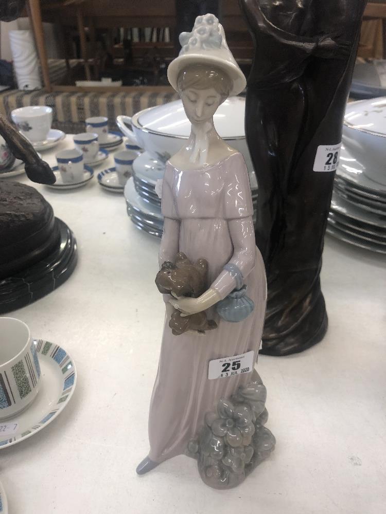 A Lladro figure of a lady,