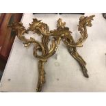 A pair of gilt wall sconces