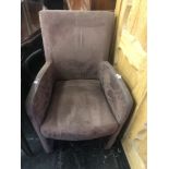 A small brown suede fireside chair