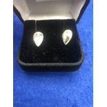 A 14ct white gold earrings set with cz stones