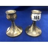 A pair of hm silver dwarf candlesticks