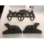 A pair of Victorian cast iron dog book ends and an early cast coat hanger