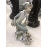 A Lladro retired country boy with shepherd,