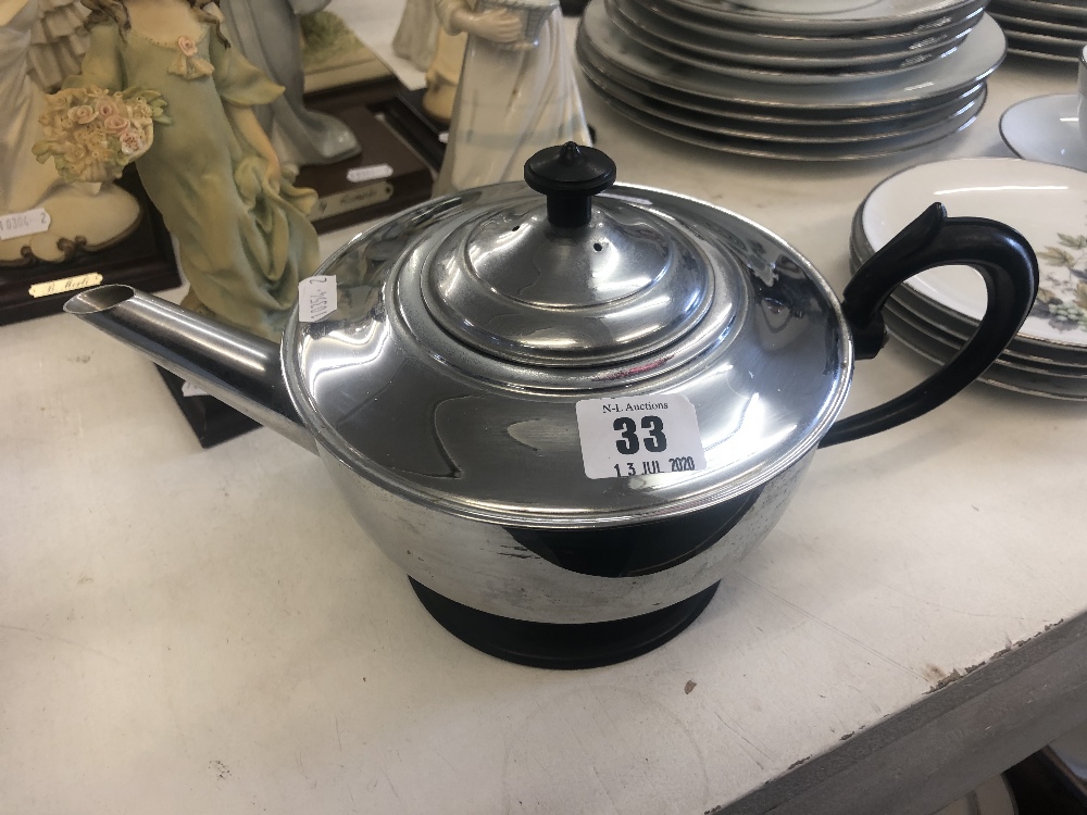 An early silver plated insulated tea pot