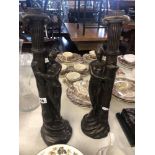 A pair of art deco style figural candle sticks