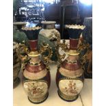 A pair of hand painted Austrian vases