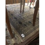 A pair of decorative brown ground rugs