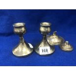 A pair of hm silver dwarf candlesticks