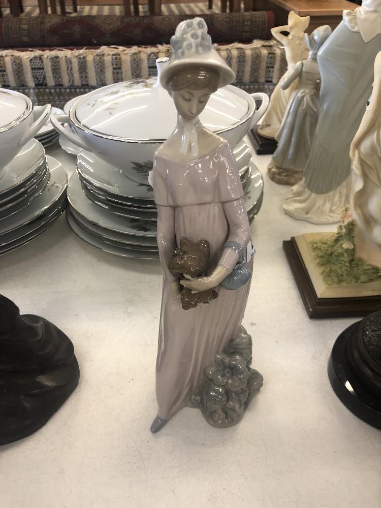 A Lladro figure of a lady,