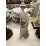 A Lladro figure of a lady,