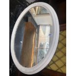 An oval painted mirror