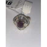 A 14ct gold Ruby ring with baguette diamonds surrounding, approx. 2.5 carats ruby, 3.98 carats of