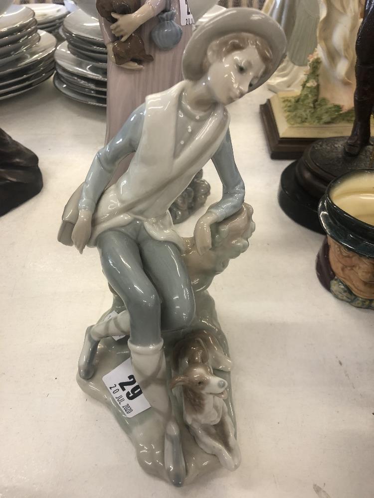 A Lladro retired country boy with shepherd,