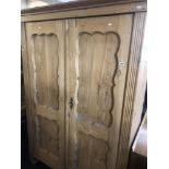 A 19th century pine double wardrobe.