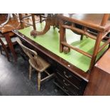 A large mahogany leather top desk