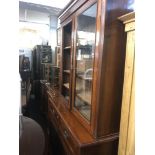 A Victorian walnut bookcase on cupboard base