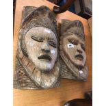 Two carved African masks