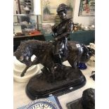 A bronze huntsman on a horse