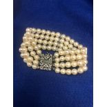 A 14ct gold pearl bracelet set with gold,