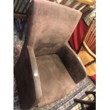 A small brown suede fireside chair